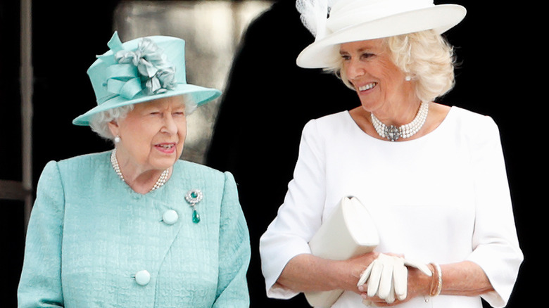 Camilla Parker Bowles and Queen Elizabeth smiling 