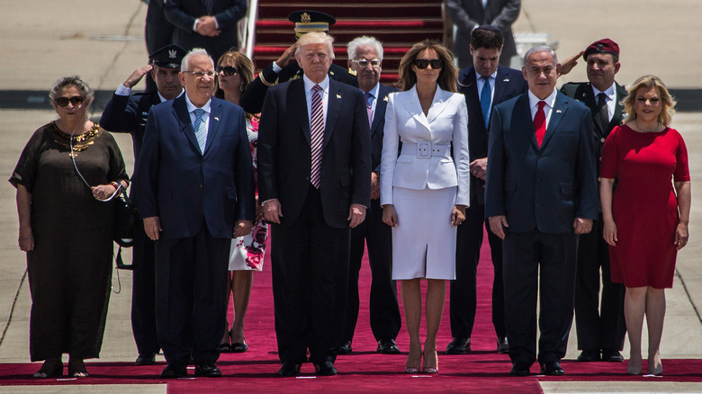 Donald Trump and his wife Melania Trump(C) standing surrunded by Israeli Prime Minister Benjamin Netanyahu and his wife Sara Netanyahu (R) as Israeli President Reuven Rivlin and his wife Nehama Rivlin (L) during an official welcoming ceremony on his arrival at Ben Gurion International Airport on May 22, 2017 near Tel Aviv, Israel.