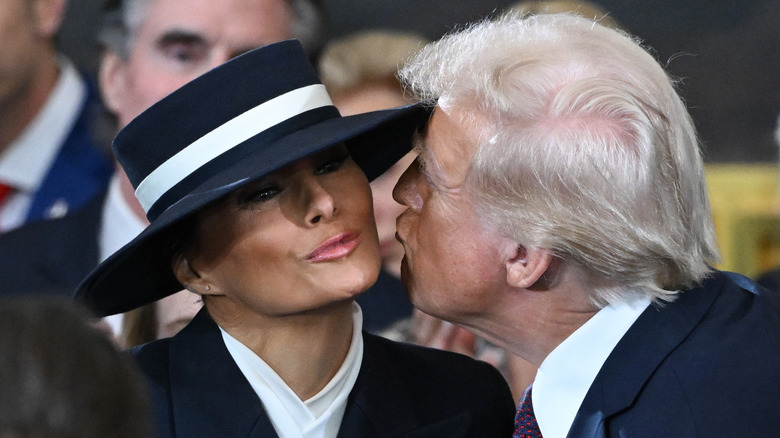Donald Trump gives Melania's cheek an air kiss on inauguration day 2025.