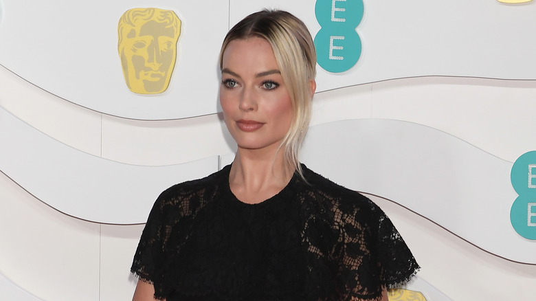 Margot Robbie posing with serious expression