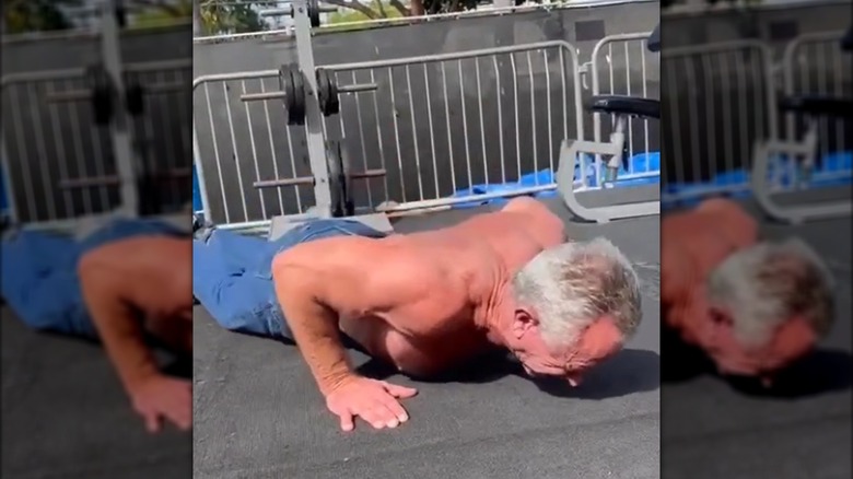 Robert F. Kennedy Jr. doing a push-up in blue jeans