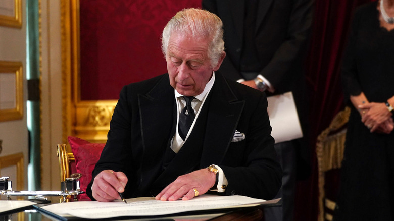 King Charles signing proclamation