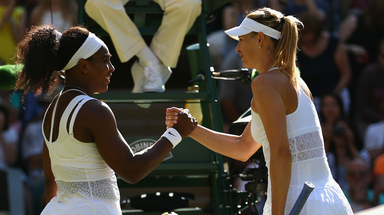 Serena Williams and Maria Sharapova hold hands in 2015