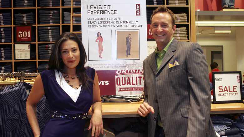 Stacy London and Clinton Kelly smiling at a Levi's store.
