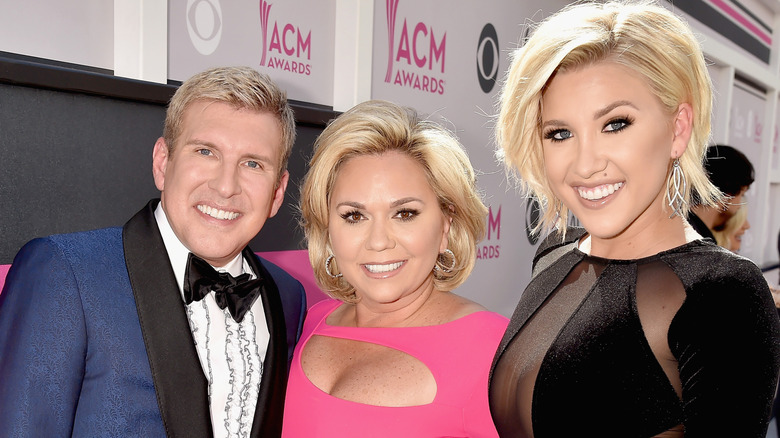 Todd Chrisley, Julie Chrisley, and Savannah Chrisley smiling