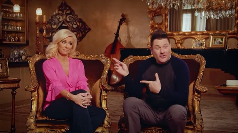 Allison and Jay DeMarcus seated in trailer for 'DeMarcus Family Rules'