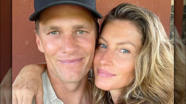 Gisele Bundchen cuddling Tom Brady