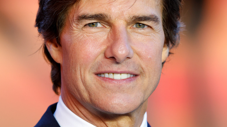 Tom Cruise suit half smile