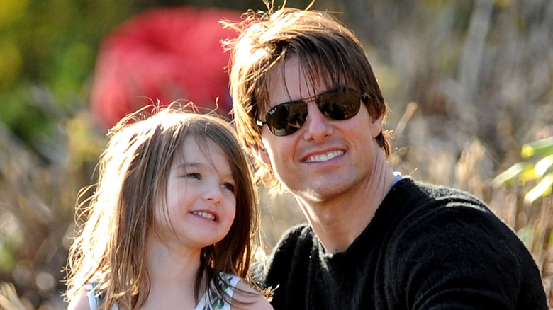 Tom Cruise smiles with Suri