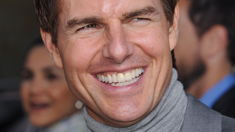 Tom Cruise laughs