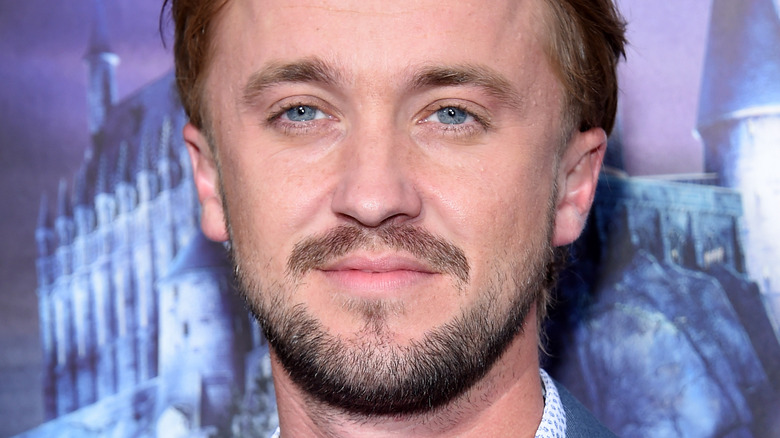 Tom Felton posing
