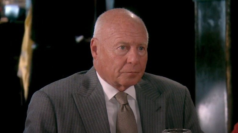 Tom Girardi sitting at a dinner table