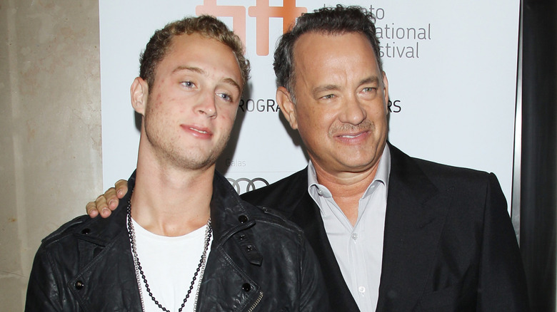 Chet Hanks with his dad on a 2012 red carpet