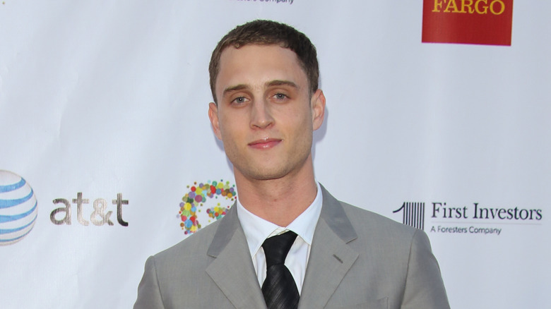 Chet Hanks in gray tux