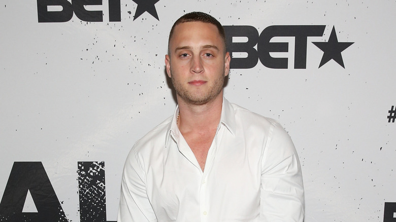 Chet Hanks in white polo