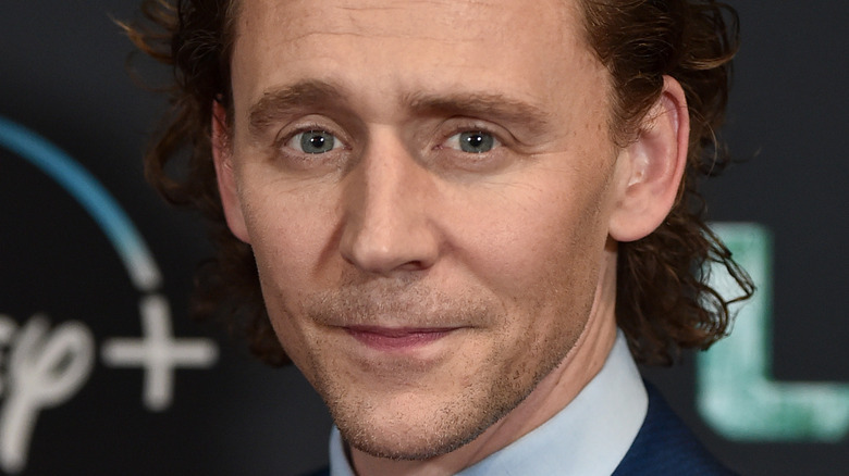 Tom Hiddleston posing