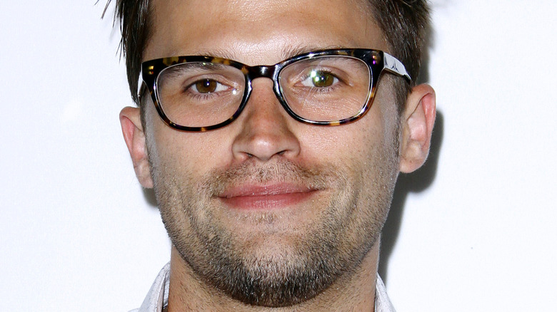 Tom Schwartz wears glasses and a white dress shirt