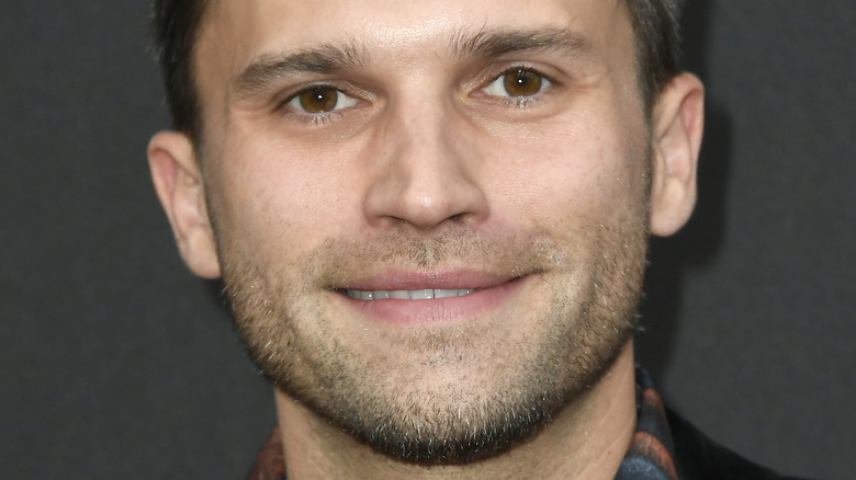 Tom Schwartz smiling in plaid shirt