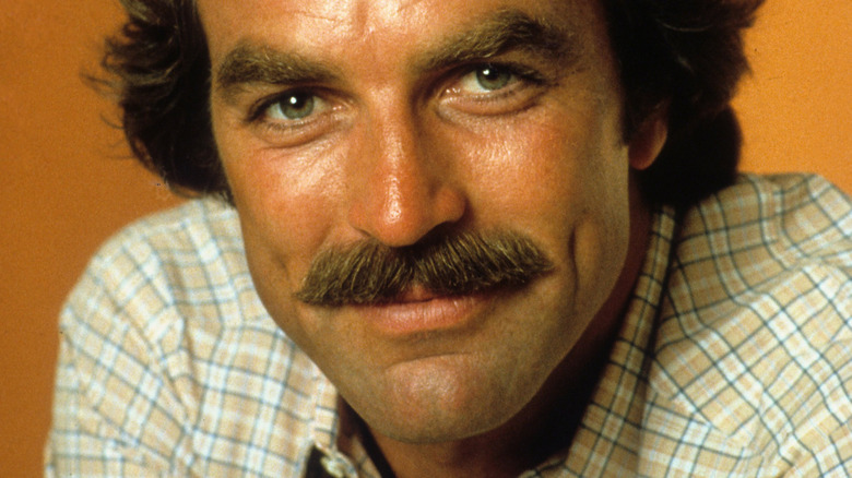 Tom Selleck smiling with mustache