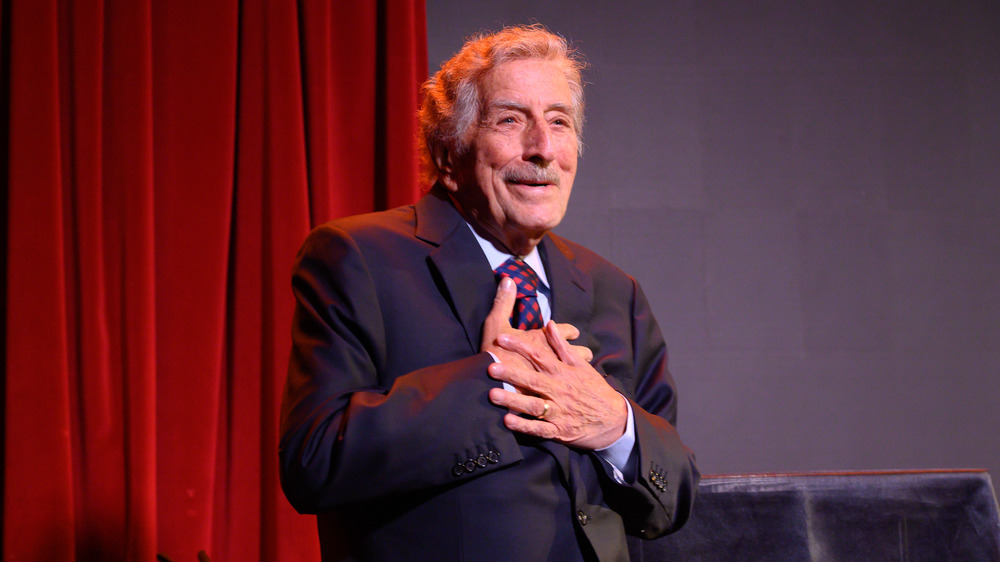 Tony Bennett with his hands on chest