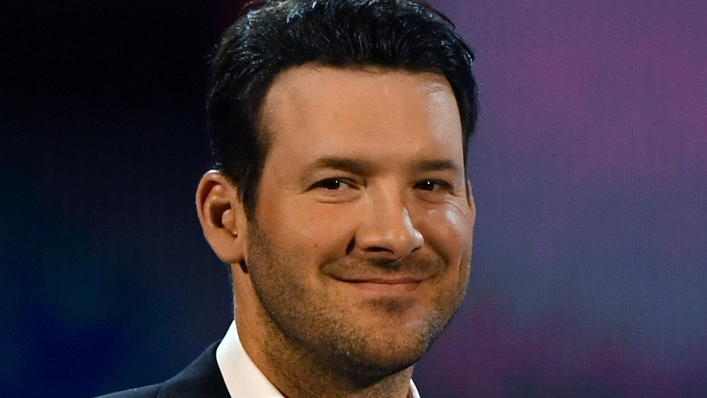Tony Romo smiling at an event