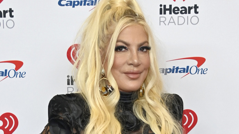 Tori Spelling in black dress