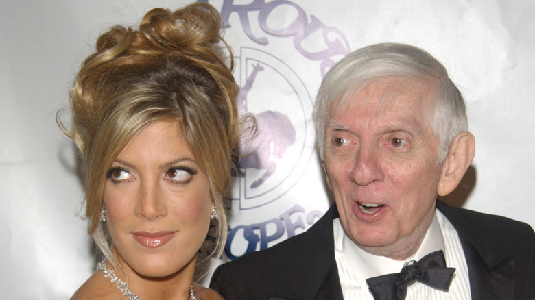 Tori Spelling and Aaron Spelling pose