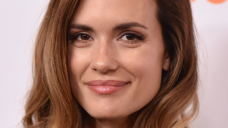 Torrey DeVitto smiling