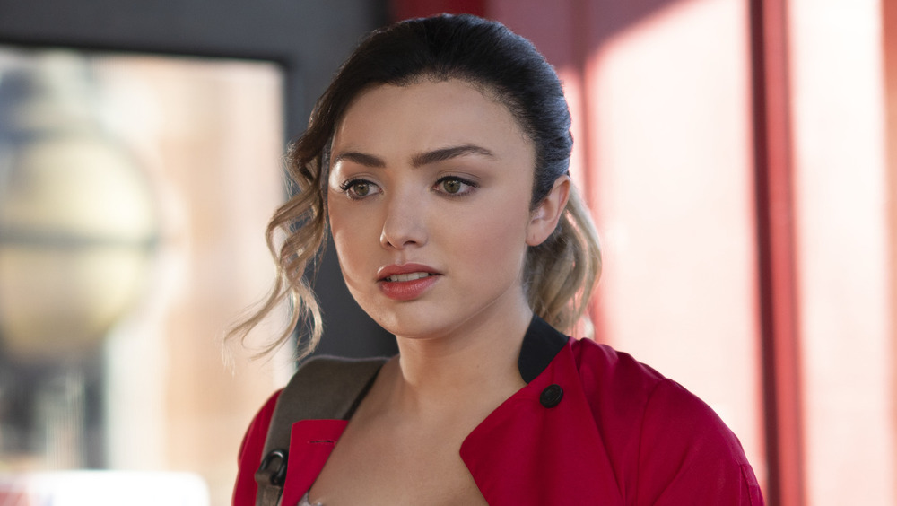 Peyton List wearing a red jacket in Cobra Kai