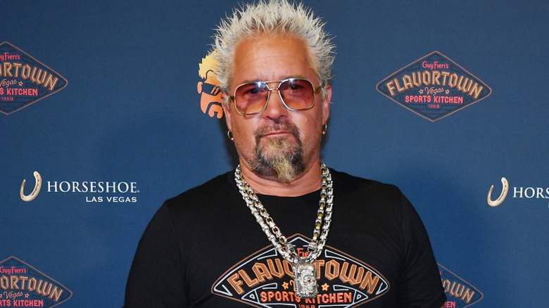 Guy Fieri wearing Flavortown on red carpet