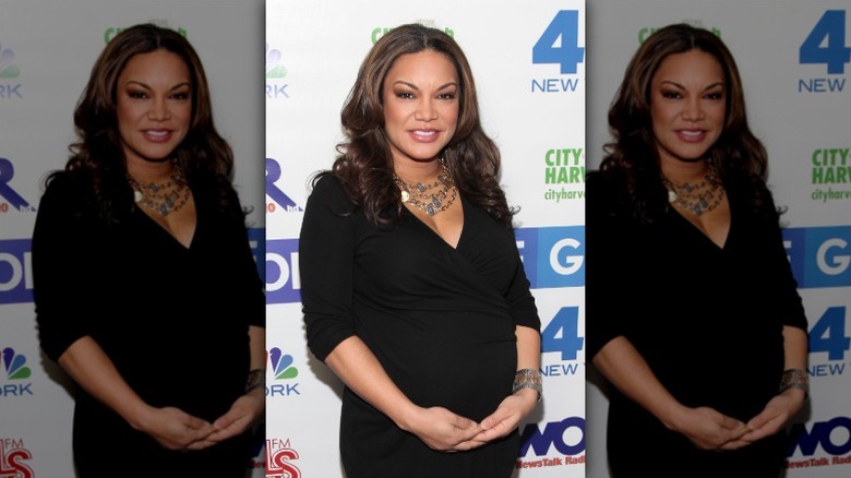 Egypt Sherrod cradles her baby bump in December 2011
