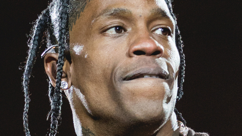 Travis Scott biting lower lip