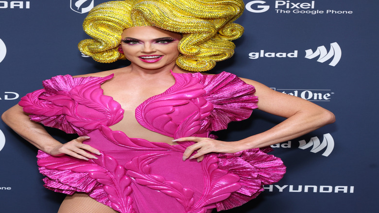 Alyssa Edwards smiling and wearing a glittery wig