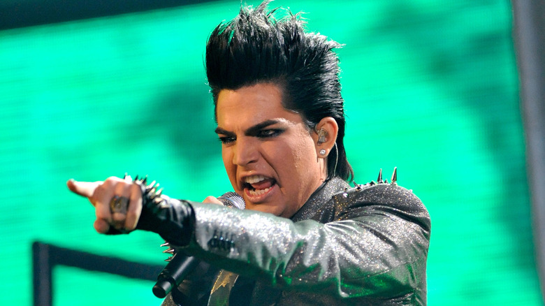 Adam Lambert pointing on stage