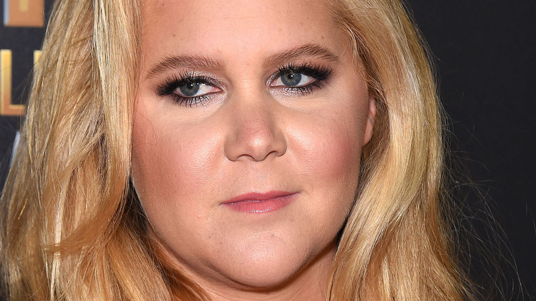 Amy Schumer at an event, looking serious