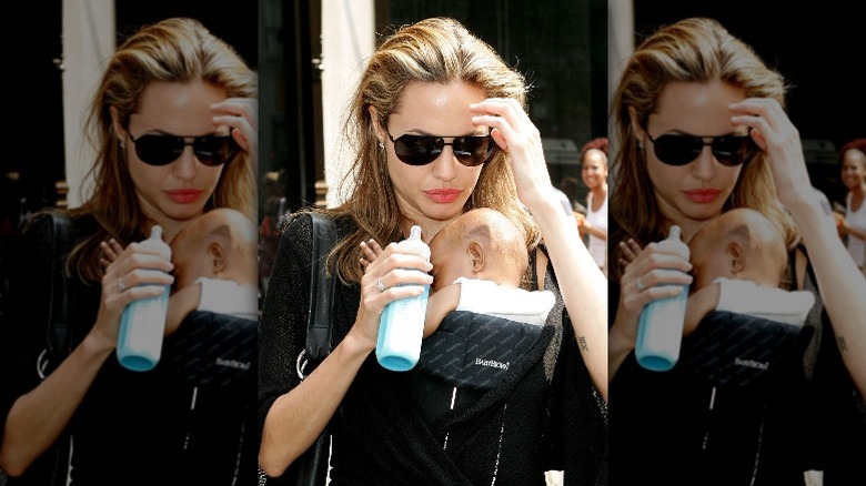 Angelina Jolie carries infant Zahara