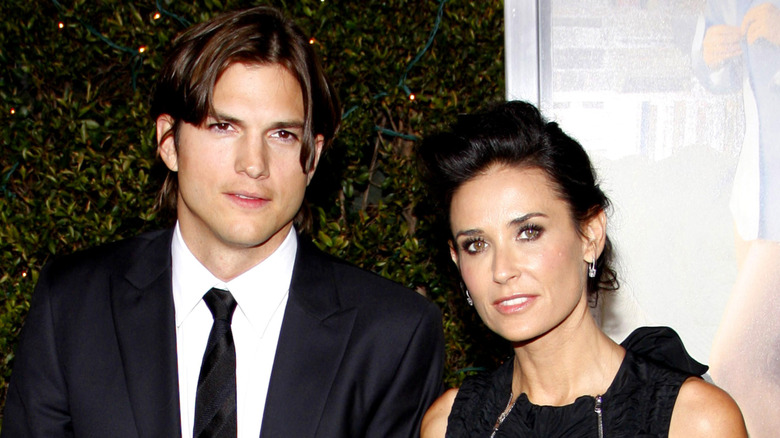 Ashton Kutcher and Demi Moore posing together