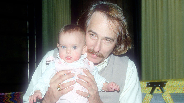 John Phillips holding baby Bijou Phillips