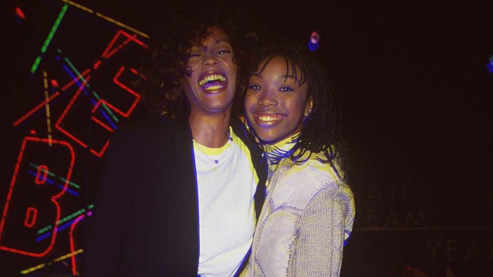 Whitney Houston and Brandy smiling together