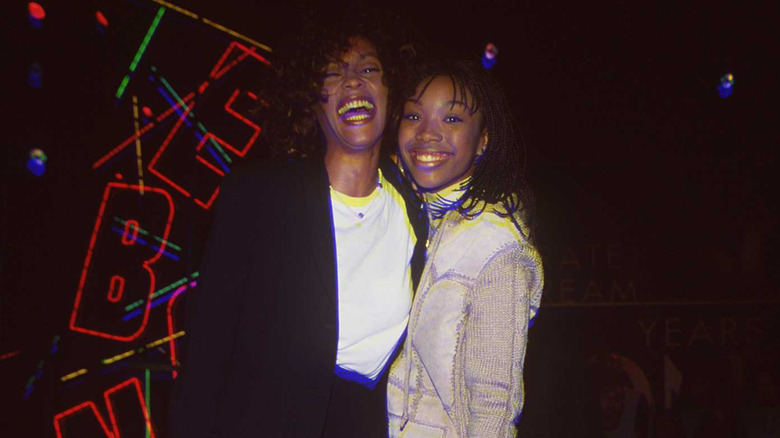 Whitney Houston and Brandy smiling together
