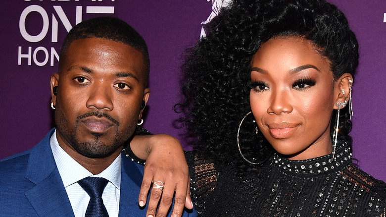 Brandy posing with brother Ray J
