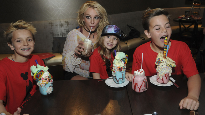 Britney Spears, her sons and niece posing with milkshakes.