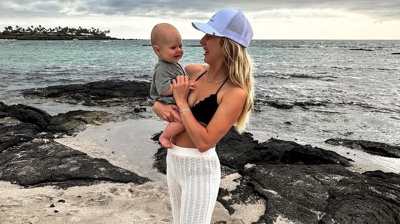 Brittany Mahomes posing with her son