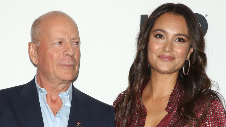 Bruce Willis gazes at Emma Heming Willis as they pose together on the red carpet.