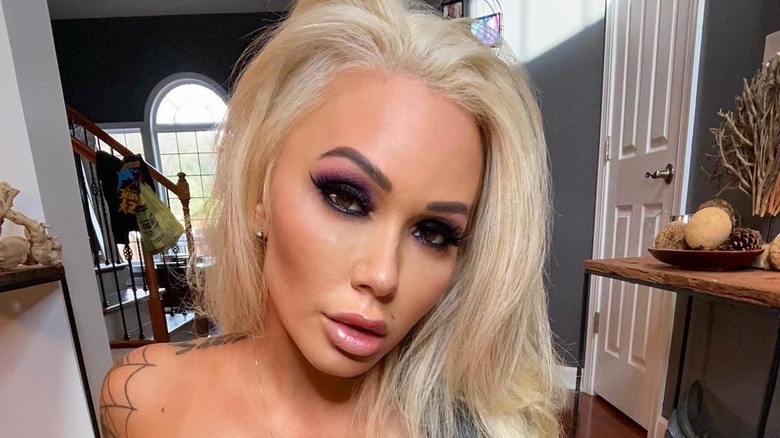 Bunnie Xo wearing pink and purple eye shadow
