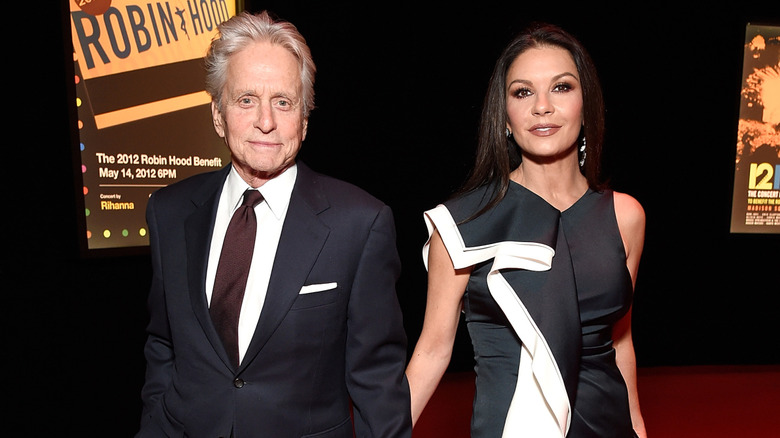 Michael Douglas and Catherine Zeta-Jones holding hands