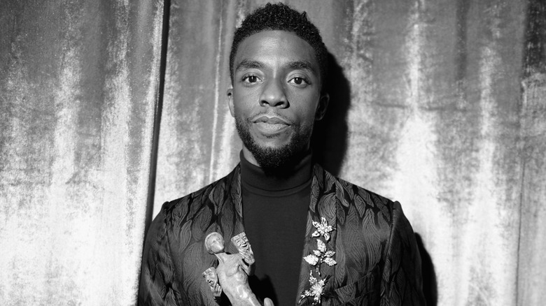 Chadwick Boseman smiling, image in black and white