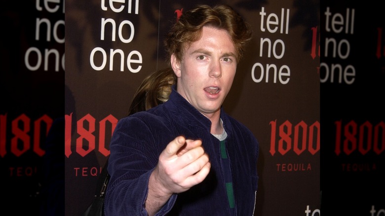 Elijah Blue Allman pointing at paparazzi while posing on the red carpet.