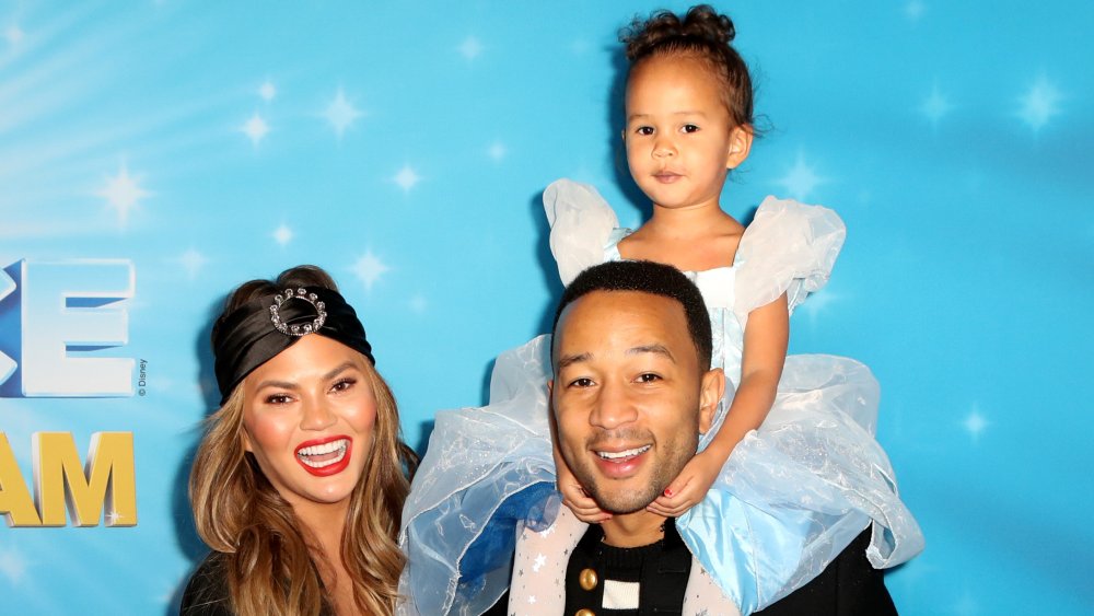 Chrissy Teigen, John Legend, and daughter Luna at a Disney on Ice event