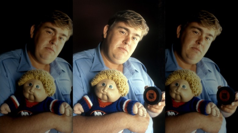 John Candy poses with a Cabbage Patch doll in 1985